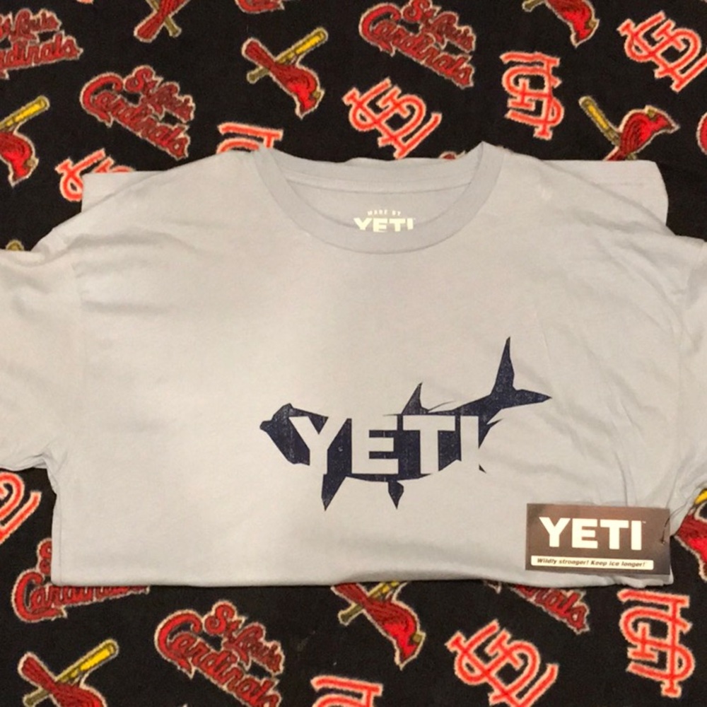 Light blue Yeti t-shirt and sticker.
